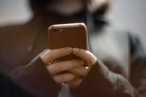 woman looking at phone