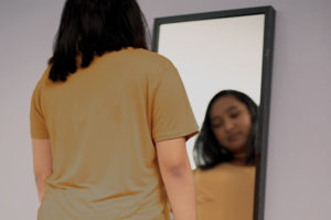 girl looking in the mirror