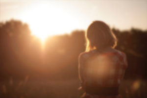 woman in blurred sunset