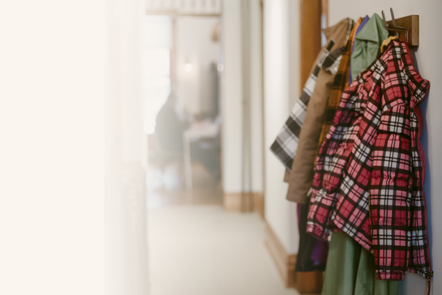 coats hanging on coat rack