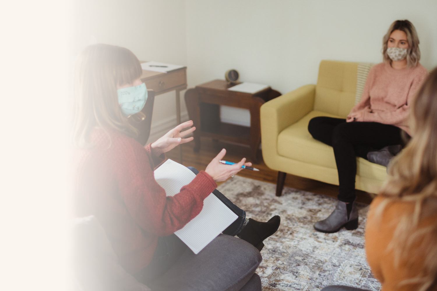 woman talking to a group in an office