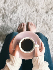 woman holding a cup of coffee