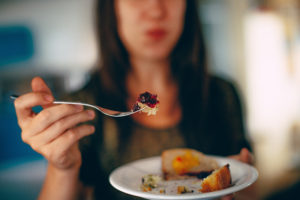 person eating a plate of food