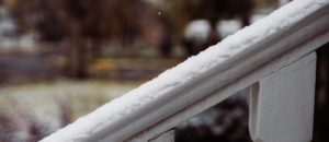 snow on hand railing