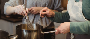 two people cooking