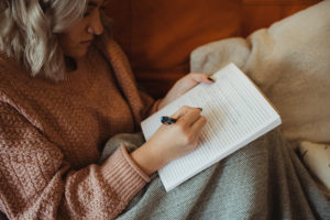 Woman writing in journal