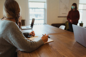 people discussing around a table